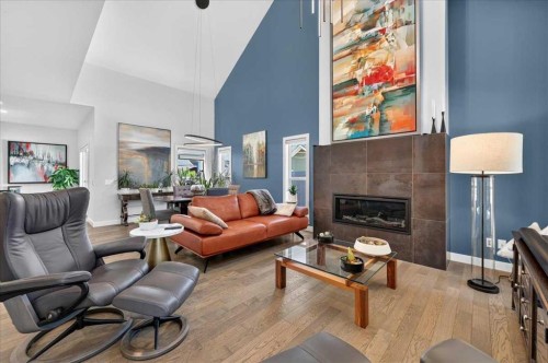 9 Drake Landing Square, Okotoks, AB - Indoor Photo Showing Living Room With Fireplace