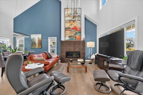 9 Drake Landing Square, Okotoks, AB - Indoor Photo Showing Living Room With Fireplace
