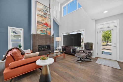 9 Drake Landing Square, Okotoks, AB - Indoor Photo Showing Living Room With Fireplace