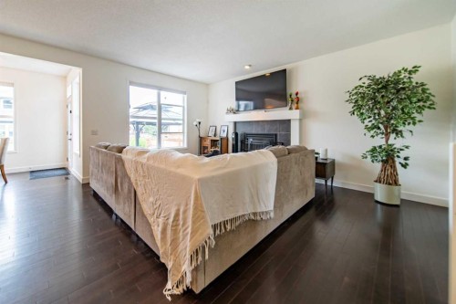 83 Auburn Glen Lane Se, Calgary, AB - Indoor Photo Showing Living Room With Fireplace