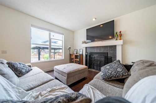 83 Auburn Glen Lane Se, Calgary, AB - Indoor Photo Showing Living Room With Fireplace