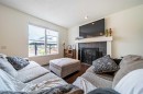 83 Auburn Glen Lane Se, Calgary, AB  - Indoor Photo Showing Living Room With Fireplace 