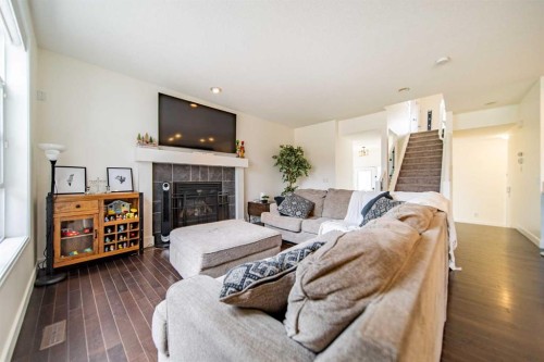 83 Auburn Glen Lane Se, Calgary, AB - Indoor Photo Showing Living Room With Fireplace
