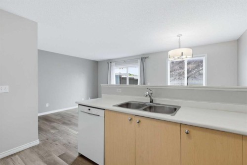 103-760 Railway Gate Sw, Airdrie, AB - Indoor Photo Showing Kitchen With Double Sink