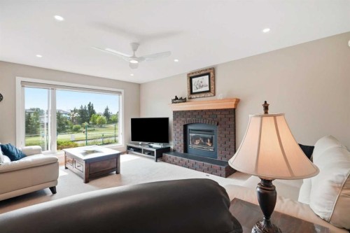 122 Douglas Woods Hill Se, Calgary, AB - Indoor Photo Showing Living Room With Fireplace