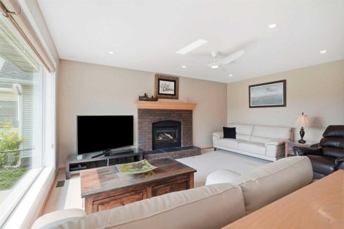 122 Douglas Woods Hill Se, Calgary, AB - Indoor Photo Showing Living Room With Fireplace