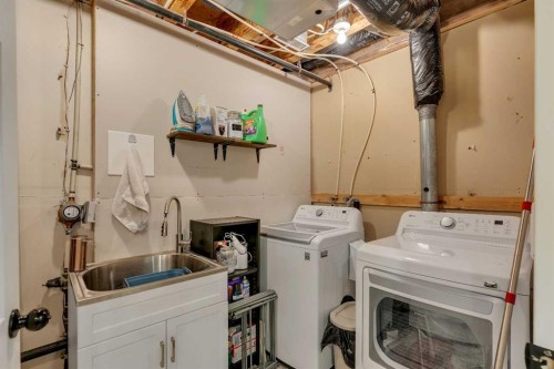 377 Tuscany Valley View Nw, Calgary, AB - Indoor Photo Showing Laundry Room
