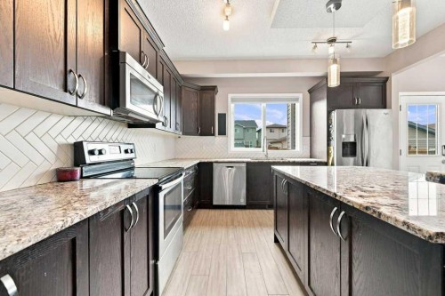 73 Legacy Common Se, Calgary, AB - Indoor Photo Showing Kitchen With Stainless Steel Kitchen With Upgraded Kitchen