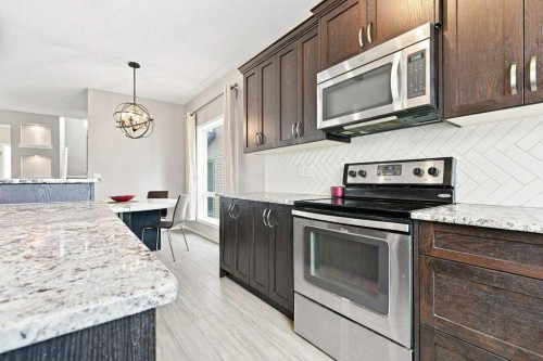 73 Legacy Common Se, Calgary, AB - Indoor Photo Showing Kitchen With Stainless Steel Kitchen