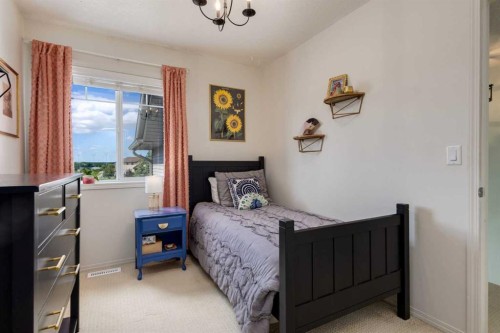 5 Brightonstone Grove Se, Calgary, AB - Indoor Photo Showing Bedroom