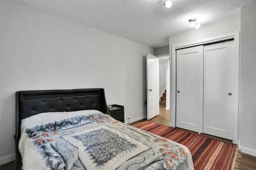 36 Coach Manor Rise Sw, Calgary, AB - Indoor Photo Showing Bedroom