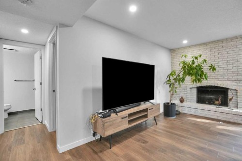 36 Coach Manor Rise Sw, Calgary, AB - Indoor With Fireplace