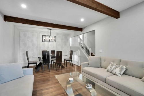 36 Coach Manor Rise Sw, Calgary, AB - Indoor Photo Showing Living Room