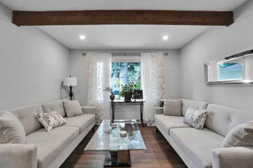 36 Coach Manor Rise Sw, Calgary, AB - Indoor Photo Showing Living Room