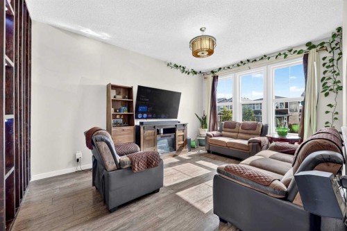 27 Red Embers Lane Ne, Calgary, AB - Indoor Photo Showing Living Room With Fireplace