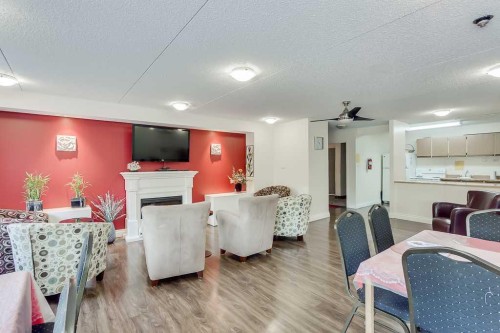 716-5204 Dalton Drive Nw, Calgary, AB - Indoor With Fireplace