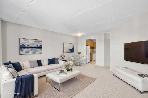 716-5204 Dalton Drive Nw, Calgary, AB - Indoor Photo Showing Living Room