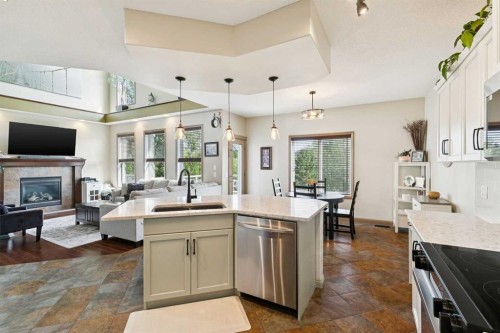 199 Lavender Way, Chestermere, AB - Indoor Photo Showing Kitchen With Fireplace