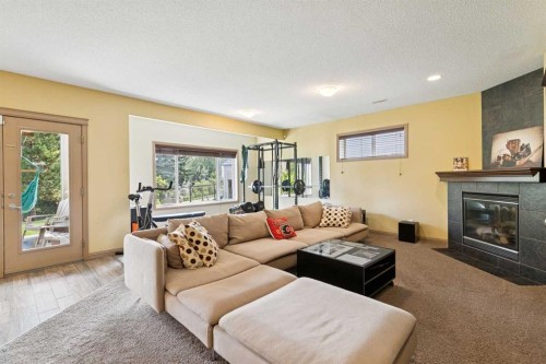 199 Lavender Way, Chestermere, AB - Indoor Photo Showing Living Room With Fireplace