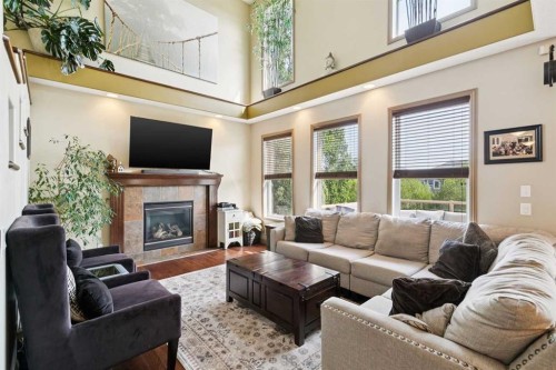 199 Lavender Way, Chestermere, AB - Indoor Photo Showing Living Room With Fireplace