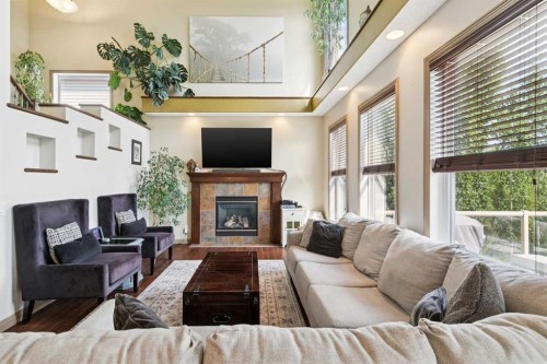 199 Lavender Way, Chestermere, AB - Indoor Photo Showing Living Room With Fireplace