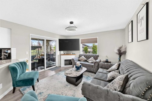 1301-6635 25 Avenue Ne, Calgary, AB - Indoor Photo Showing Living Room With Fireplace