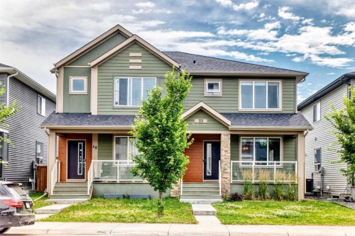 52 Wolf Creek Drive Se, Calgary, AB - Outdoor With Deck Patio Veranda With Facade