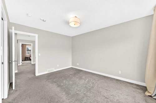 52 Wolf Creek Drive Se, Calgary, AB - Indoor Photo Showing Other Room