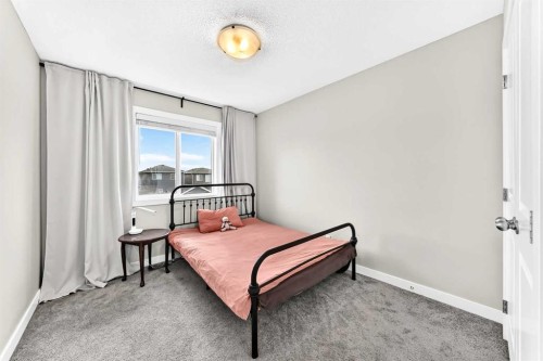 52 Wolf Creek Drive Se, Calgary, AB - Indoor Photo Showing Bedroom