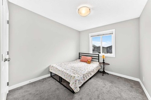 52 Wolf Creek Drive Se, Calgary, AB - Indoor Photo Showing Bedroom