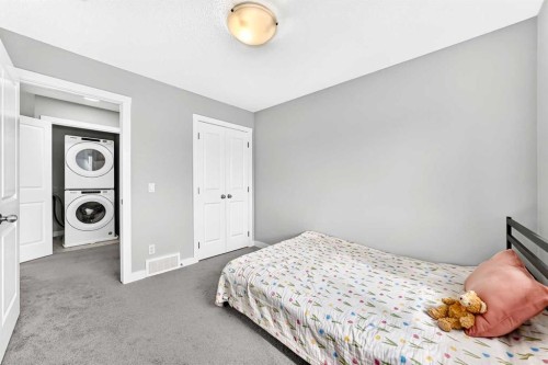 52 Wolf Creek Drive Se, Calgary, AB - Indoor Photo Showing Bedroom
