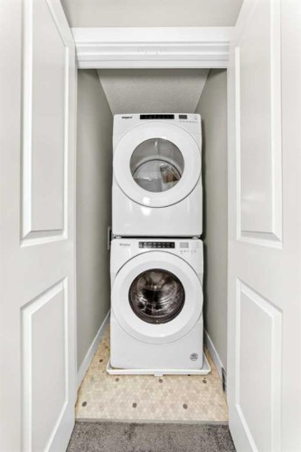 52 Wolf Creek Drive Se, Calgary, AB - Indoor Photo Showing Laundry Room