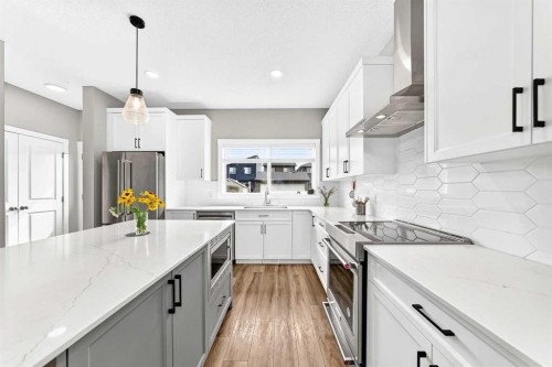 52 Wolf Creek Drive Se, Calgary, AB - Indoor Photo Showing Kitchen With Stainless Steel Kitchen With Upgraded Kitchen