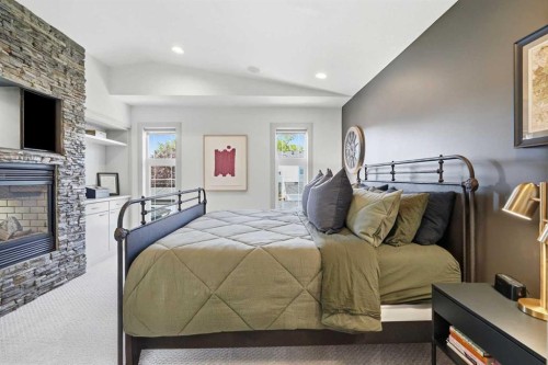 2042 49 Avenue Sw, Calgary, AB - Indoor Photo Showing Bedroom With Fireplace