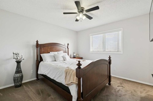 438 Sheep River Point, Okotoks, AB - Indoor Photo Showing Bedroom