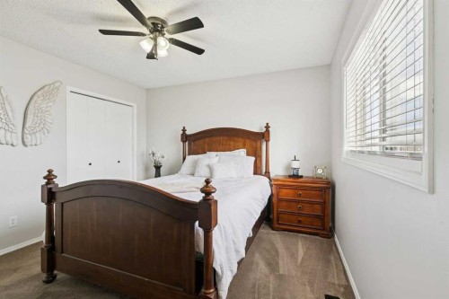 438 Sheep River Point, Okotoks, AB - Indoor Photo Showing Bedroom