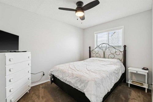 438 Sheep River Point, Okotoks, AB - Indoor Photo Showing Bedroom