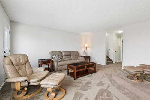 438 Sheep River Point, Okotoks, AB - Indoor Photo Showing Living Room