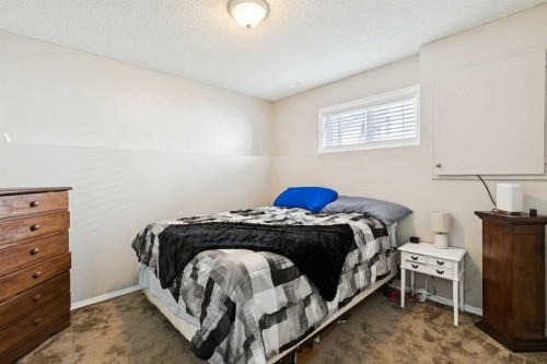 438 Sheep River Point, Okotoks, AB - Indoor Photo Showing Bedroom