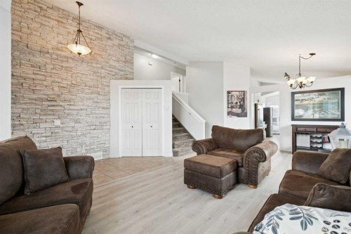 438 Sheep River Point, Okotoks, AB - Indoor Photo Showing Living Room