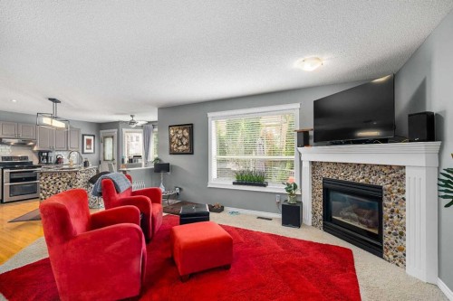 224 Arbour Ridge Way Nw, Calgary, AB - Indoor Photo Showing Living Room With Fireplace