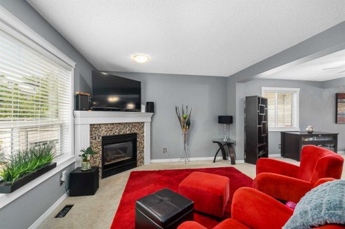 224 Arbour Ridge Way Nw, Calgary, AB - Indoor Photo Showing Living Room With Fireplace