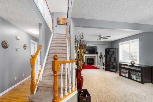 224 Arbour Ridge Way Nw, Calgary, AB - Indoor Photo Showing Other Room With Fireplace