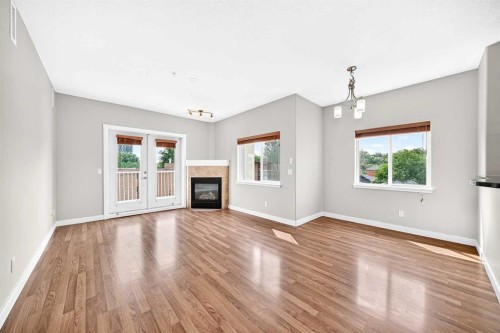 305-509 21 Avenue Sw, Calgary, AB - Indoor Photo Showing Living Room With Fireplace