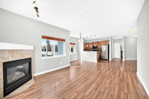 305-509 21 Avenue Sw, Calgary, AB - Indoor Photo Showing Living Room With Fireplace