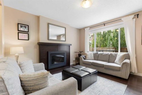 165 Cranarch Common Se, Calgary, AB - Indoor Photo Showing Living Room With Fireplace