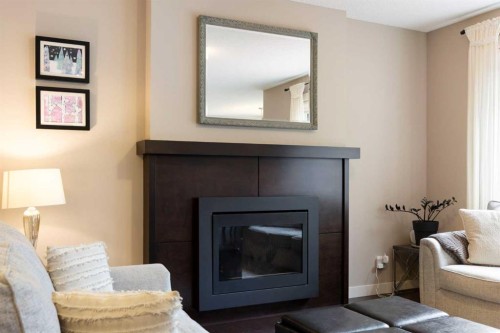 165 Cranarch Common Se, Calgary, AB - Indoor Photo Showing Living Room With Fireplace