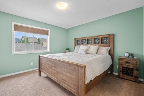 219 New Brighton Landing Se, Calgary, AB - Indoor Photo Showing Bedroom
