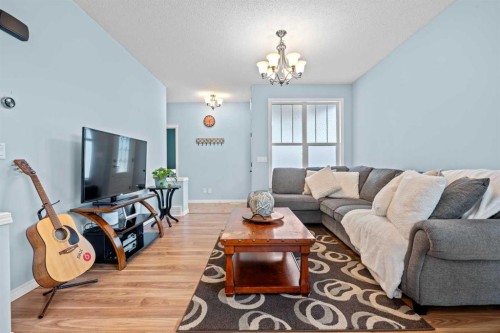 219 New Brighton Landing Se, Calgary, AB - Indoor Photo Showing Living Room
