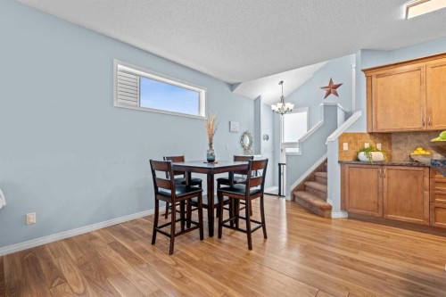 219 New Brighton Landing Se, Calgary, AB - Indoor Photo Showing Dining Room